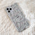 Clear phone case with a pattern of 3D skeletons Feat