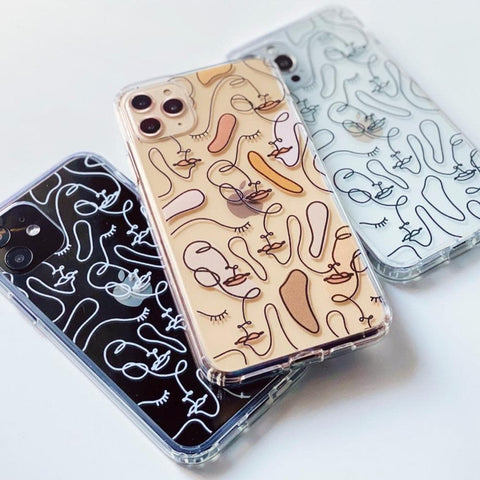 Clear phone case with abstract line art faces as the design. Feat