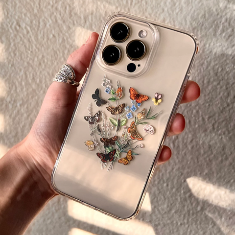 Multiple butterflies in different colors on a clear phone case Feat
